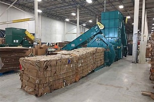 Industrial cardboard baler with compressed cardboard bale