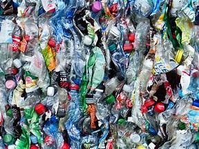 Colorful compressed plastic bottles and containers ready for recycling